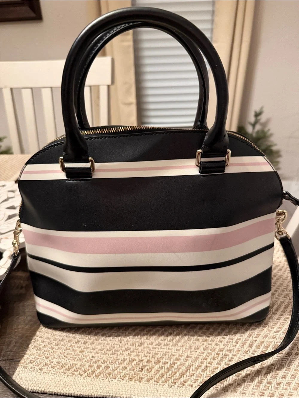 Kate Spade Grove Street Carli Satchel features a classic look